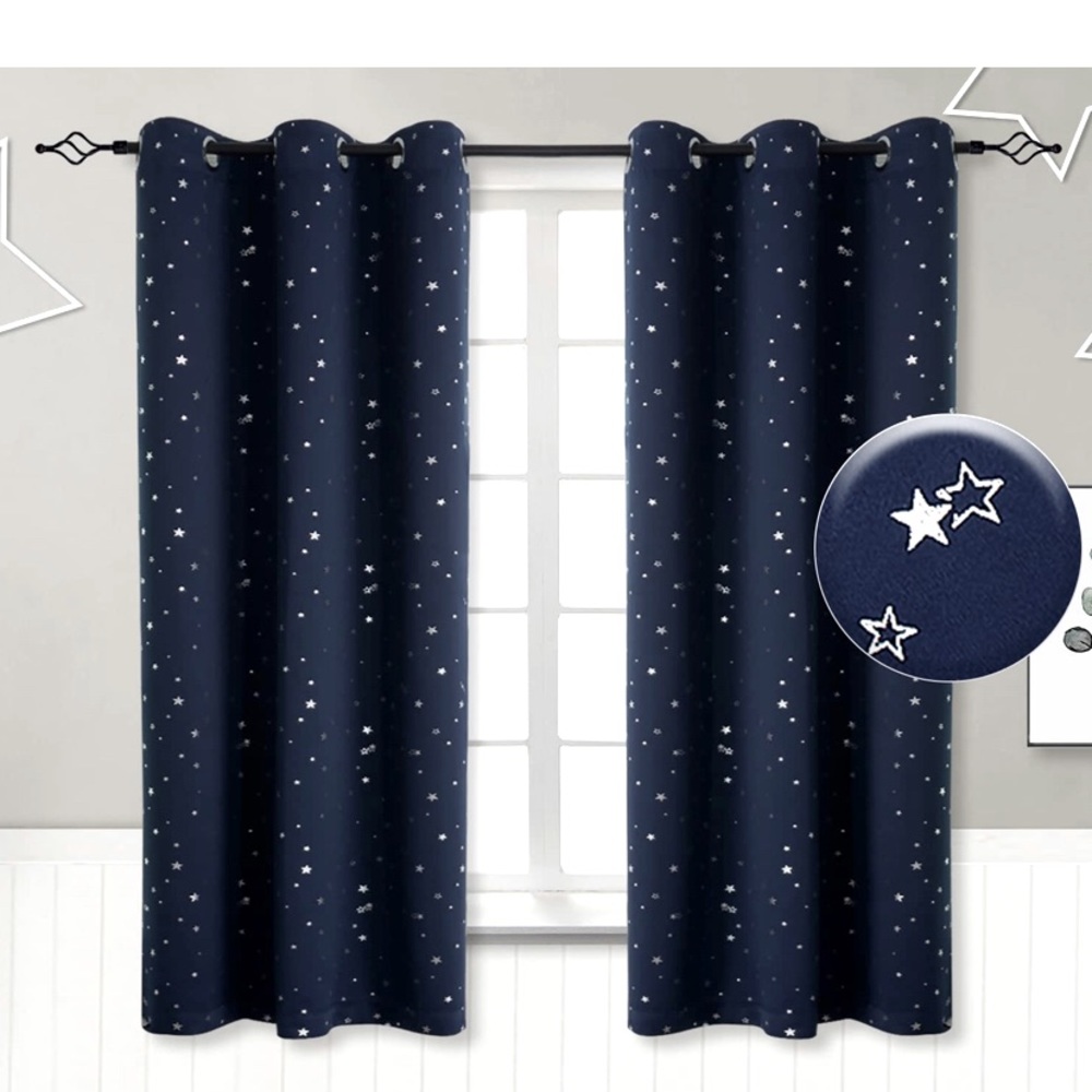 Two navy blue start curtains with silver stars